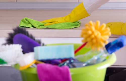 Cleaning staff wearing PPE while handling dust and allergens