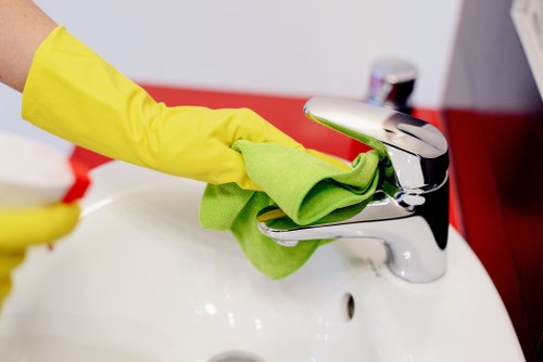 Kitchen being cleaned after unwanted items have been cleared from the property