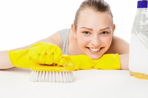 Vacuuming floors and removing construction dust in an empty property