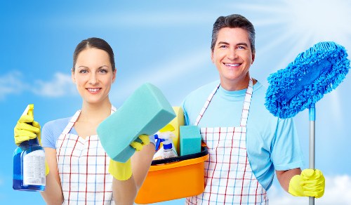 Local move out cleaning team detailing a built-in kitchen oven