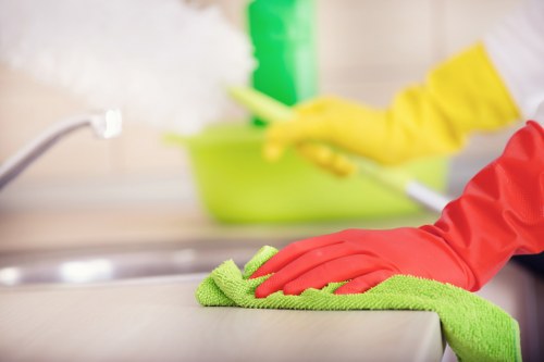 Move out cleaning team preparing hard floors for inspection